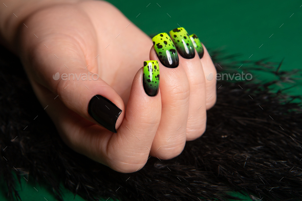 Female neat hand with short natural nails painted with green nail polish. Natural, cozy, elegant - Stock Photo - Images