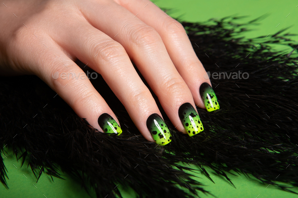 Female neat hand with short natural nails painted with green nail polish. Natural, cozy, elegant - Stock Photo - Images