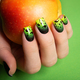 Female neat hand with short natural nails painted with green nail polish holding apple.  - PhotoDune Item for Sale