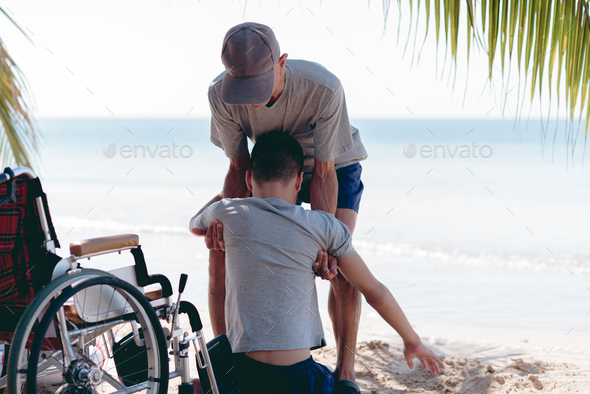 Outdoor activity with travel by wheelchair . - Stock Photo - Images