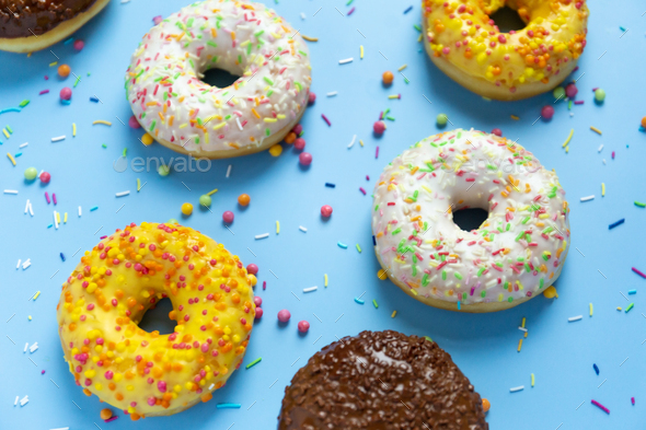 Donuts on blue background - Stock Photo - Images
