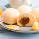 Japanese rice sweet buns mochi filled with tangerine jam and cup of coffee on a blue wooden - PhotoDune Item for Sale