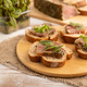 Bread sandwiches with jerky salted meat, sorrel and cilantro microgreen on white wooden - PhotoDune Item for Sale