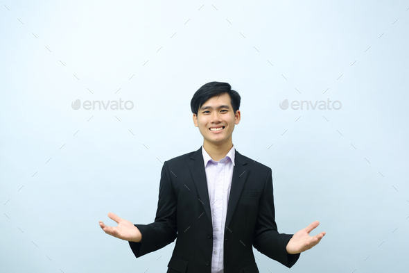 Portrait of businessman standing with open arms. - Stock Photo - Images