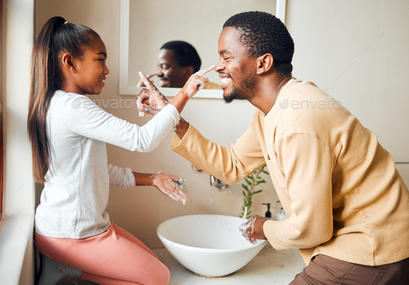 Black family, soap nose and washing hands for health and wellness in home bathroom. Man teaching gi