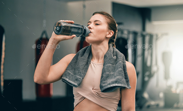 women with bottles of water in gym, Stock image