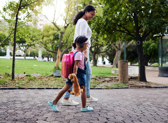 Mother, daughter and walking in a park, relax and bonding while holding hands and talking. Family, - Stock Photo - Images