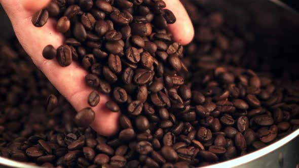 The Super Slow Motion of the Coffee Beans Falls From the Man's Hand alt