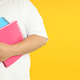 Fat man with notebooks on yellow background, space for text - PhotoDune Item for Sale
