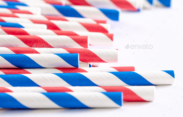 Multi-colored paper straws for drinks close-up on a white background. - Stock Photo - Images
