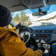 Cold wave, danger on the road, Man driving a car with snow on the mountain, view from inside - PhotoDune Item for Sale