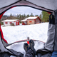 A man resting in a tent on a winter morning on the snow - PhotoDune Item for Sale