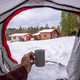 Having a coffee in a cup inside a tent on a winter morning, winter free camping - PhotoDune Item for Sale