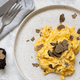 Scrambled eggs with fresh black truffles from Italy served in a plate top view, gourmet breakfast - PhotoDune Item for Sale