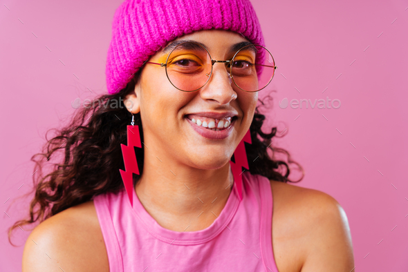 Creative studio portrait of beautiful hispanic woman with diastema - Stock Photo - Images