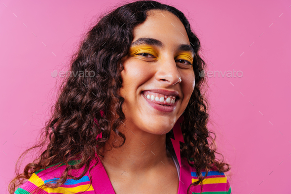 Creative studio portrait of beautiful hispanic woman with diastema - Stock Photo - Images