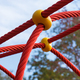 Red rope as mesh for climbing on playground - PhotoDune Item for Sale