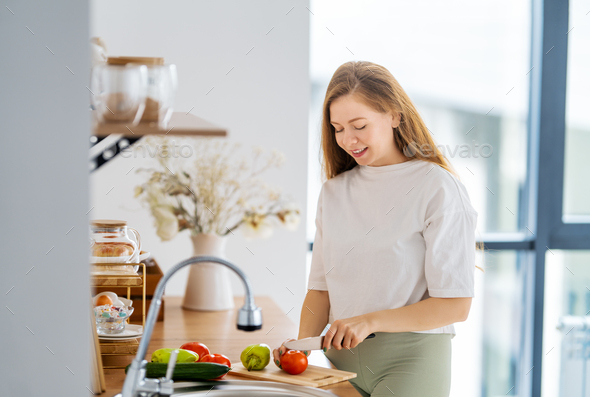 woman is preparing proper meal - Stock Photo - Images