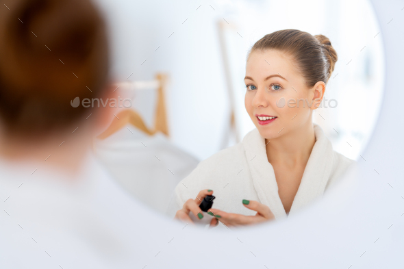 woman with cream for her face - Stock Photo - Images