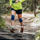 male athlete runner in knee pads run forest trail race - PhotoDune Item for Sale