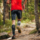 male runner in compression calf sleeve running forest trail - PhotoDune Item for Sale