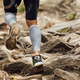 legs male runner in compression socks run over rocks - PhotoDune Item for Sale