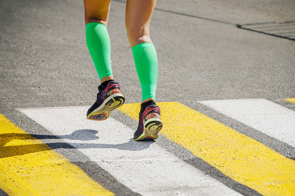 legs girl runner in bright green compression socks