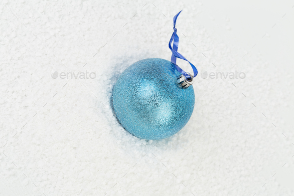 Blue Christmas ball on a blue ribbon. - Stock Photo - Images