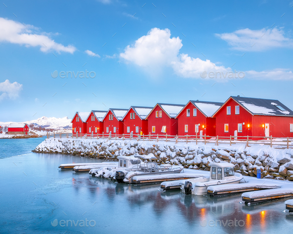 Breathtaking scenery wit traditional red wooden houses on the shore of Offersoystraumen fjord. - Stock Photo - Images