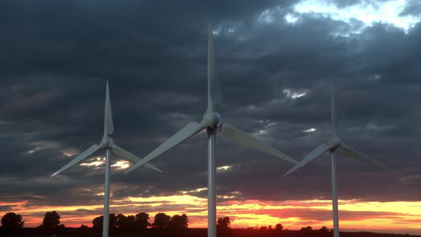 Wind Turbine Farm on Beautiful Cloudy Sky Background alt