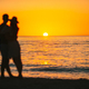 Young couple spending time together on the beach. Photo out of focus - PhotoDune Item for Sale