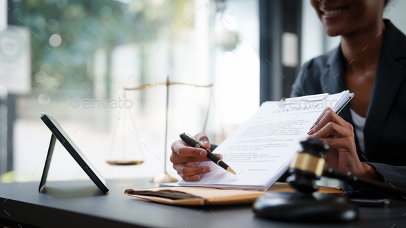 Lawyer working at office. Asian Lawyer doing with contract or document in  office. Law, legal Stock Photo by itchaznong