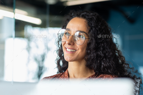 Portrait of successful businesswoman wearing glasses inside office, woman  looking out window Stock Photo by voronaman111