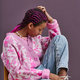 Black teenage girl wearing trendy casual clothes posing sitting on chair - PhotoDune Item for Sale