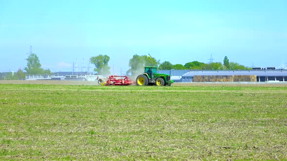 Farm Tractor With the Plough alt