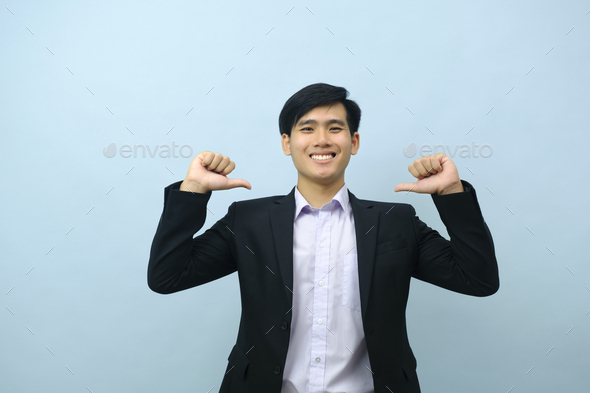 Portrait of businessman pointing thumb finger at himself. - Stock Photo - Images