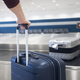 Suitcase in baggage claim in airport terminal - PhotoDune Item for Sale