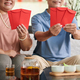 Senior Couple with Red Envelopes - PhotoDune Item for Sale