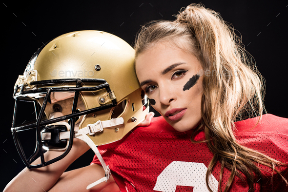 Attractive female american football player in uniform posing with helmet.  girl sportswoman. Gender equality Stock Photo - Alamy