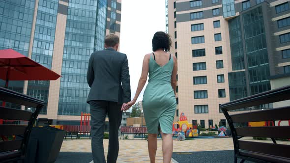 Happy family buying housing in a high-rise building in the mortgage	 alt