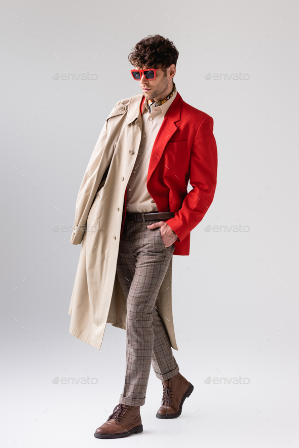 Handsome Young Man Wearing Elegant Coat Posing At Table Outside On Urban  Background. Stock Photo, Picture and Royalty Free Image. Image 91895012.