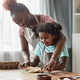 Candid loving mother and daughter baking together at home - PhotoDune Item for Sale