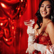Portrait of happy smiling sexy asian girl glam makeup in red lingerie with coupe champagne glass - PhotoDune Item for Sale