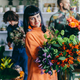 Woman working with florists in flower store - PhotoDune Item for Sale