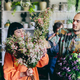 Woman working with florists in flower store - PhotoDune Item for Sale