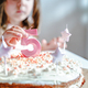 Big pink 5 number candle on homemade cake. Creative congratulations on five years for child girl.  - PhotoDune Item for Sale