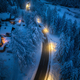 Aerial view of road in town in snow, forest, houses at night - PhotoDune Item for Sale