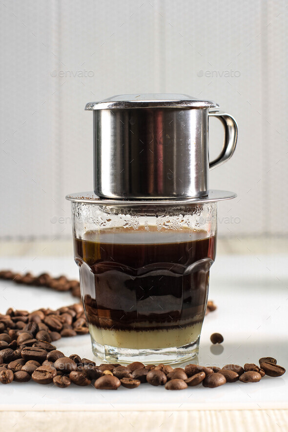 Vietnamese Coffee with Condensed Milk in Glass Cups and Traditional Metal Coffee  Maker Stock Photo by ikadapurhangus