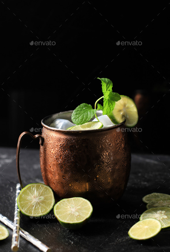 Icy Cold Moscow Mule Coctail on Copper Mug with Ginger Beer, Lime, and