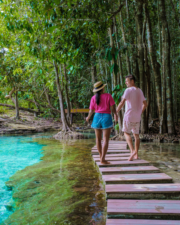 Couple visit the Emerald pool and Blue pool in Krabi Thailand, mangroves, crystal clear water - Stock Photo - Images